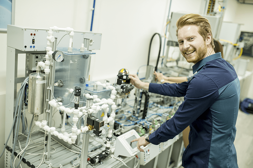 Young robotics engineer working in a lab improving dental implant technology