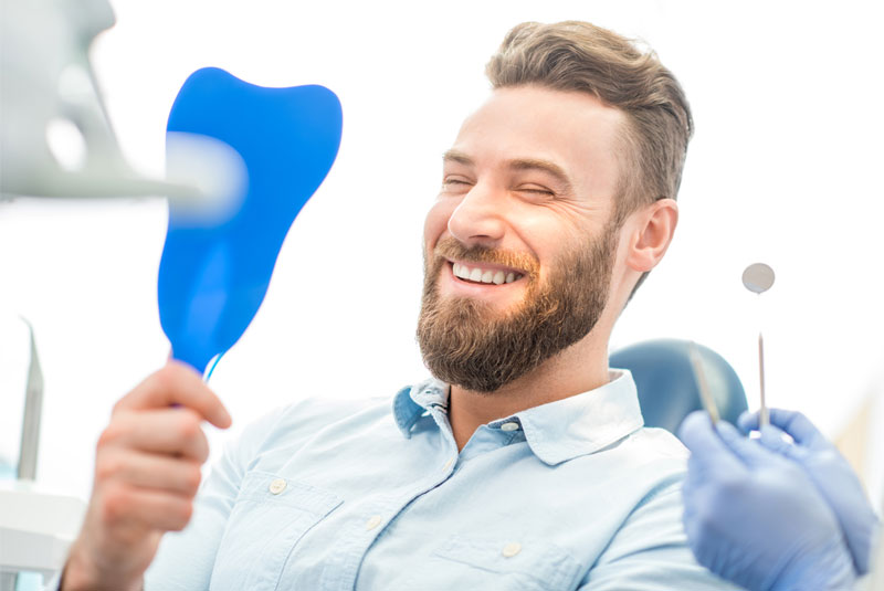dental patient smiling after orthodontics procedure