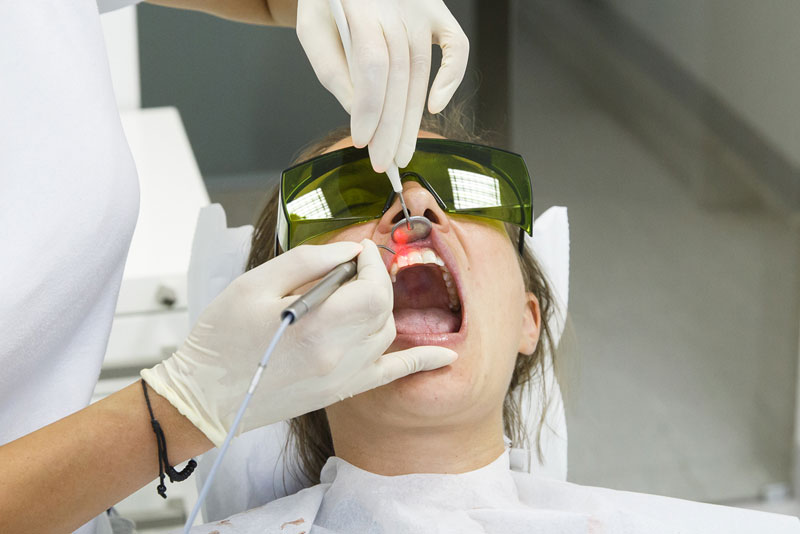 Dental Patient Undergoing A Laser Gum Disease Procedure