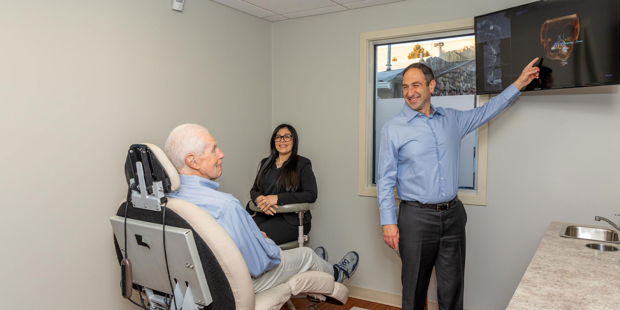 dr with patient discussing yomi robotic procedure