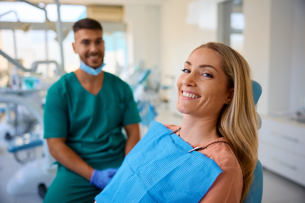 Dentist consulting patient about back teeth replacement options.